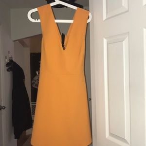 Worn 2 times orange dress with open back so cute